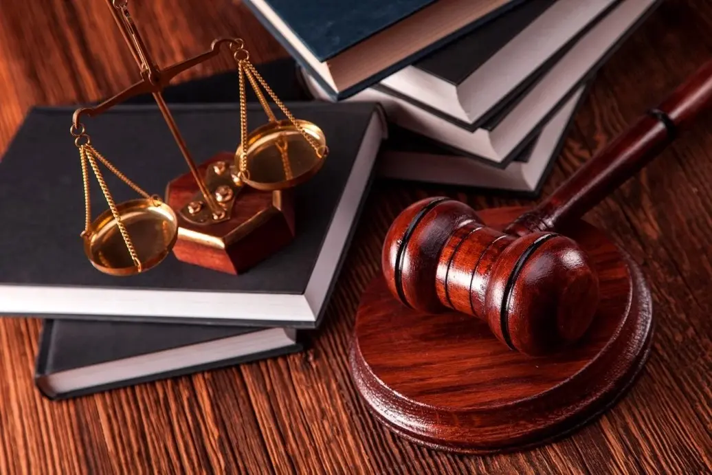 Scales of justice and legal books in a law office